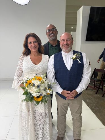 Dennis with Carlos and Laura Beth after their wedding ceremony.