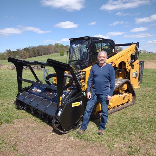 Randy with his 137 horse power Cat 275XE and 83” Cat 418 Mulcher. More bang for your money!