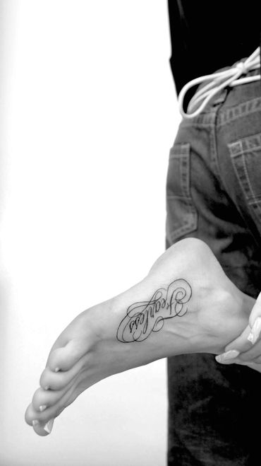 Fine line foot tattoo