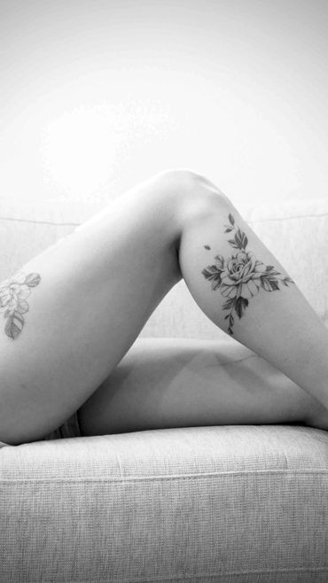 Fine line floral tattoo
