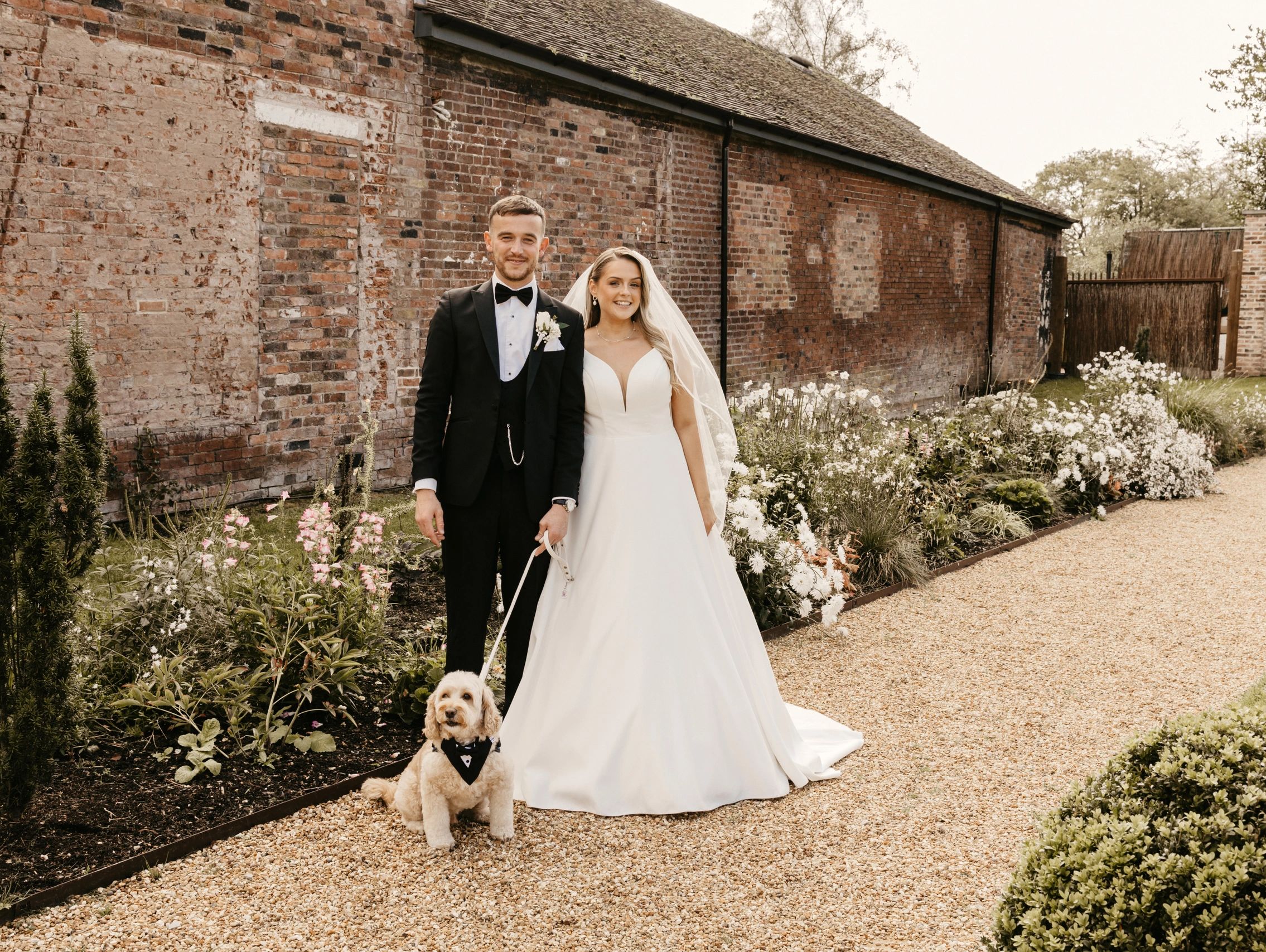 Bride and groom with their dog