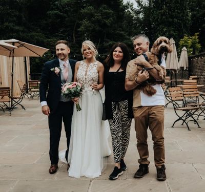 Wedding dog chaperones with the Bride and groom on their dog
