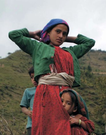 A young Nepali woman from the Shipti region of Darchula District wearing a hemp cloth sash belt.