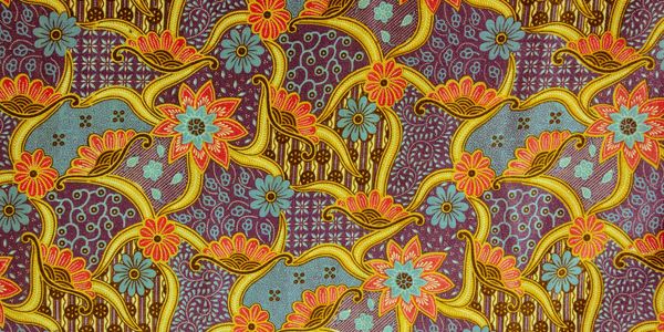 Colorful floral batik pattern with intricate yellow and red details.