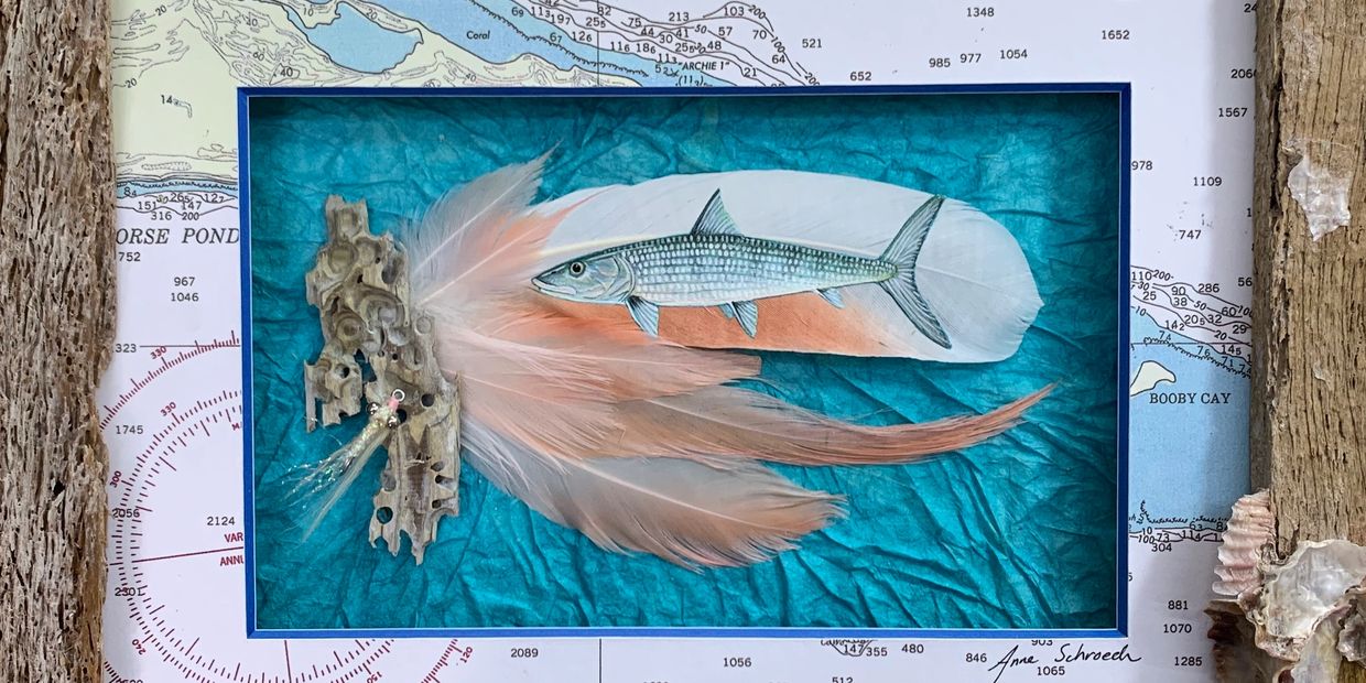 This is a bonefish I painted on feathers. Then I matted it with a chart of where my client fishes.