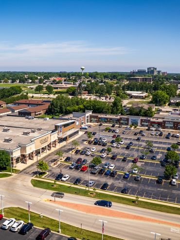 Aerial view of a suburban shopping center with Barnes & Noble and ALDI stores.