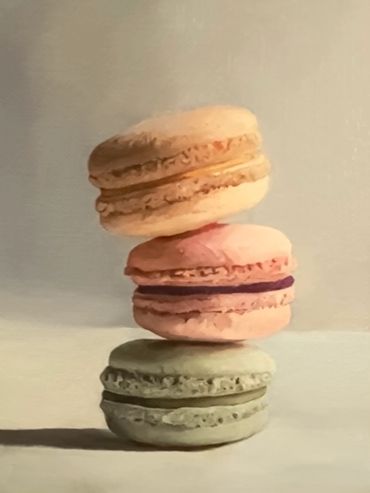 Realistic painting of three stacked macarons in pastel colors.