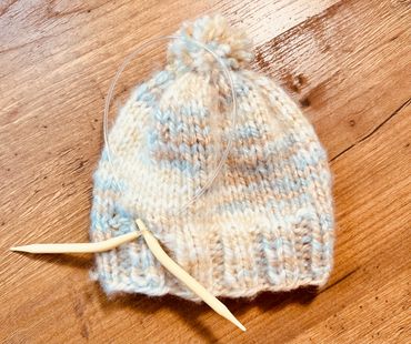 Hand knitted baby hat.