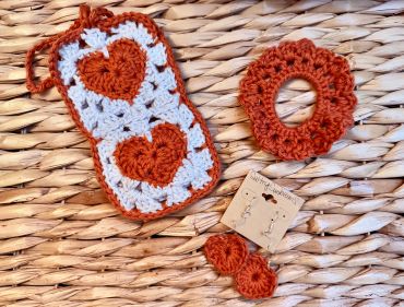 Gift set of crochet sunglasses holder, heart earrings, and hair scrunchie.