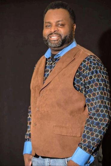 Photo of Jermaine Jackson standing and smiling