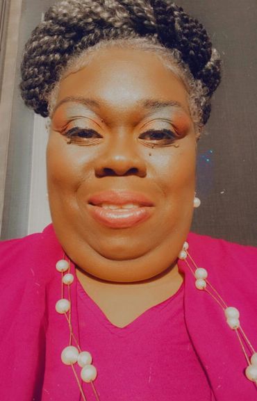 Headshot photo of Katrina M. Goodall smiling.