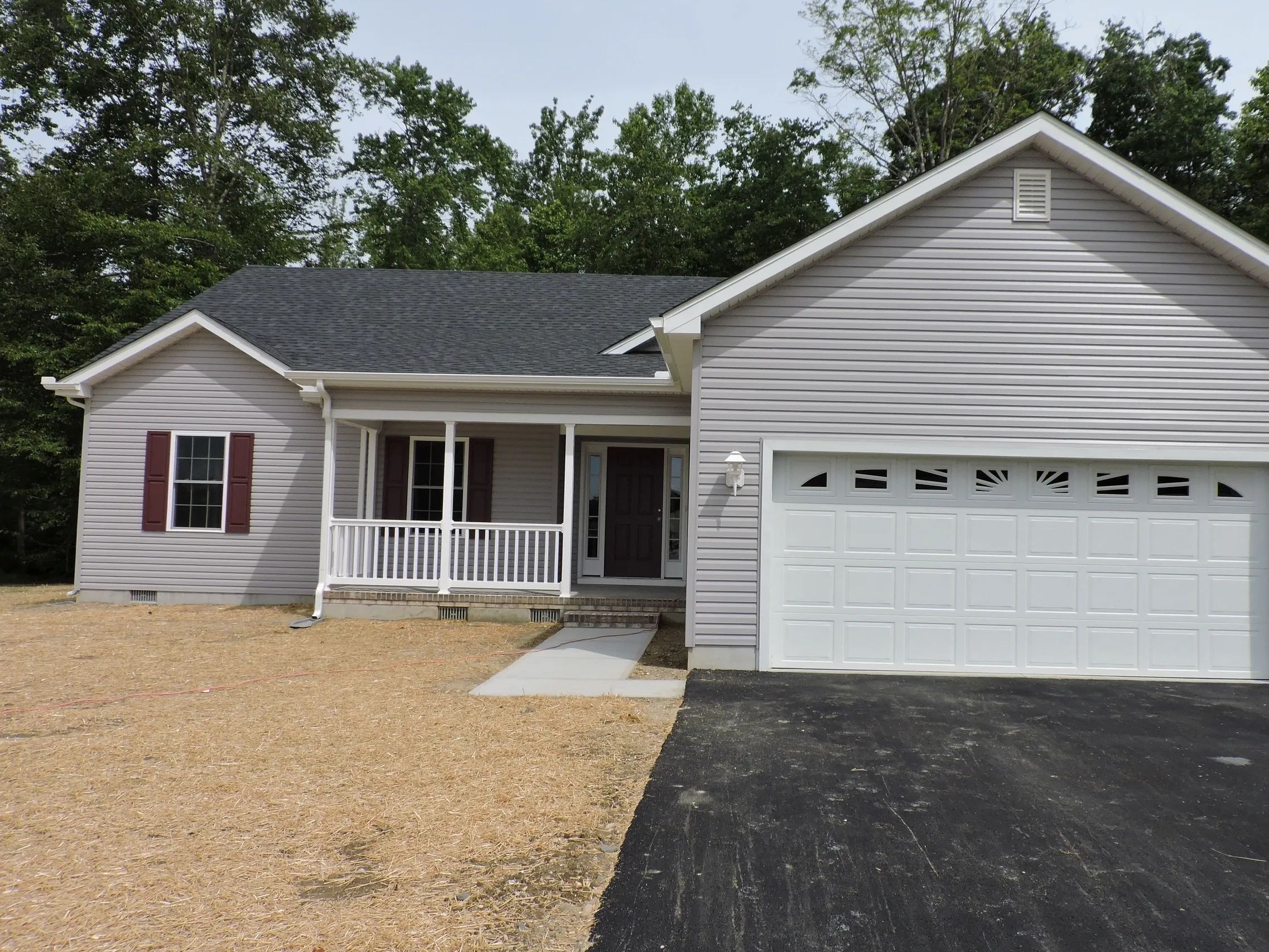 Ocean View Model with 4 Bedrooms, 2.5 bathrooms, a two-car garage, front porch, and screen porch.