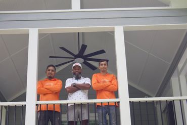 Character Craftsmen crew under the finished screened gable porch in East Cobb, GA