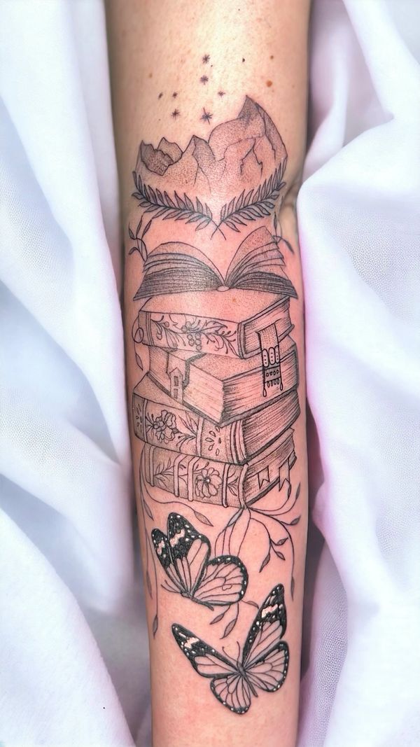 Magical fantasy books and butterflies arm tattoo idea