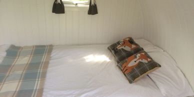 Double bed inside little barn eco pod