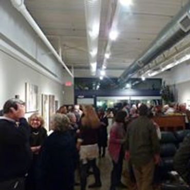 A crowd at an opening art reception at Ledbetter Gallery.