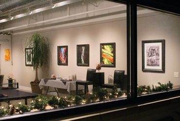 Looking inside Ledbetter Gallery through the outside windows before an opening art reception.