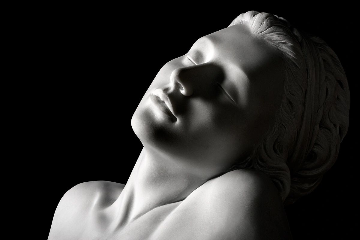 Marble sculpture of a woman's face created by Marcello Giorgi sculptor.