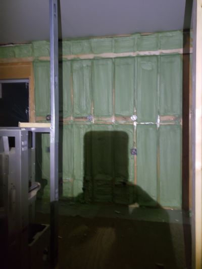2lb Sprayfoam concrete wall in basement up to code
