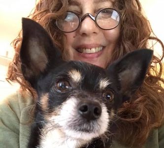 Shelah Barr holds her cute terrier mix