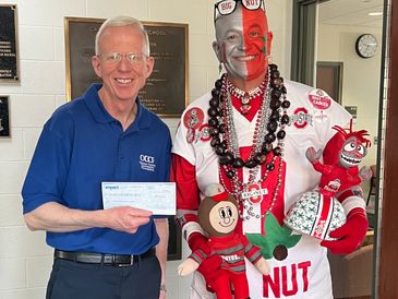 Shea McGrew accepts check from Jon Peters to start "Big Nut" scholarship