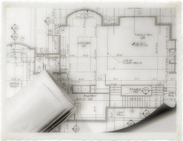 Architectural blueprint with rolled-up plans.