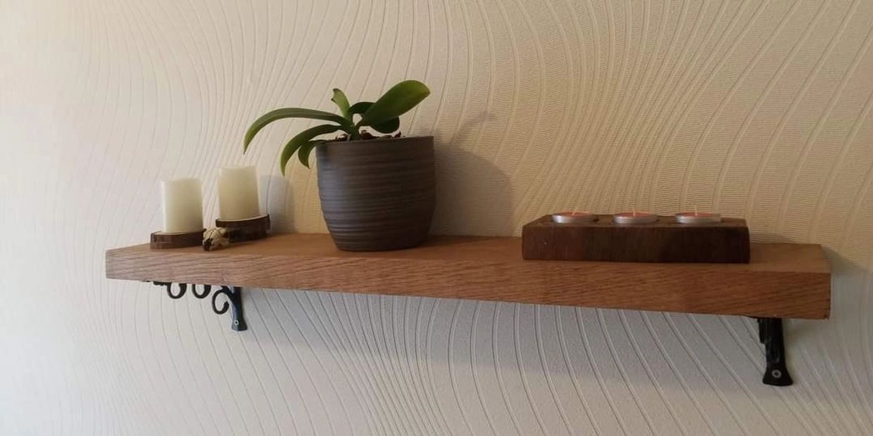 Rustic real wood custom made shelf fitted on a wall with metal brackets