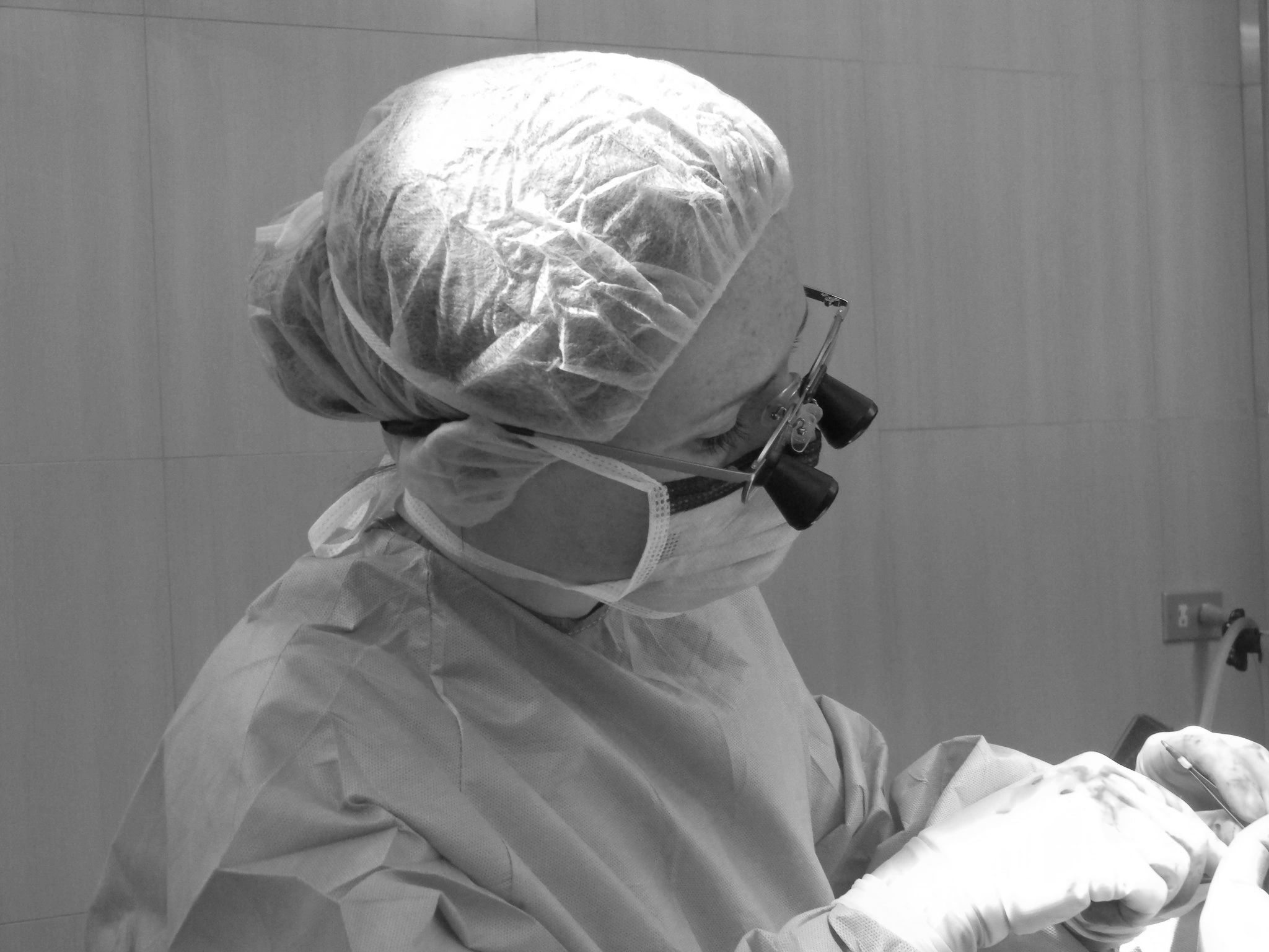 Dr.McKee, hand surgeon, works during a surgery.