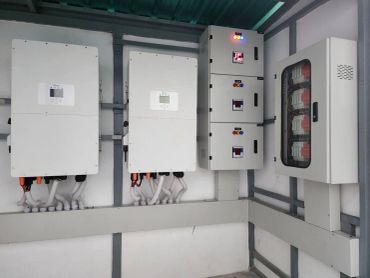 Electrical control panels and devices mounted on a wall.