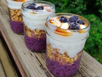 Blueberry cake in a jar with blue berry slices