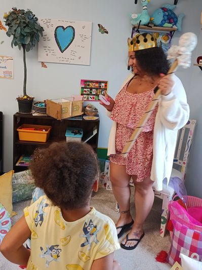 A teacher playing with children at the Art Explorers Club - Perkasie, PA
