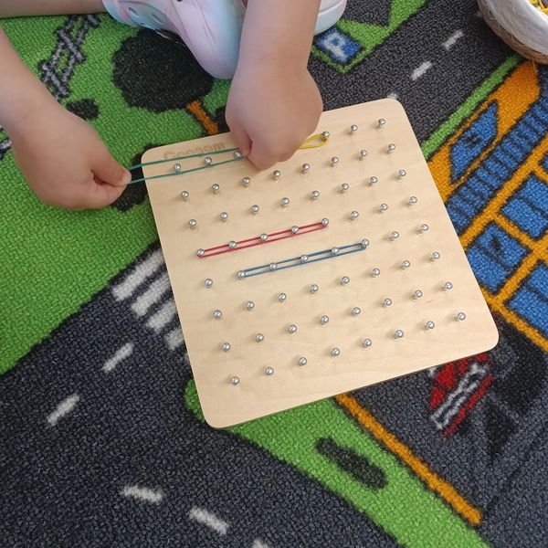A child playing a math game in the Art Oasis' Bright SPARKS Program in Perkasie PA