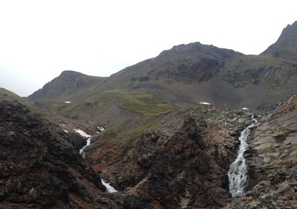 The water falls on the way to the summit of Crow Pass.