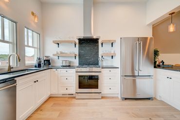 Penthouse mountain views in all directions. Boutique Kalispell lodging. With full kitchen