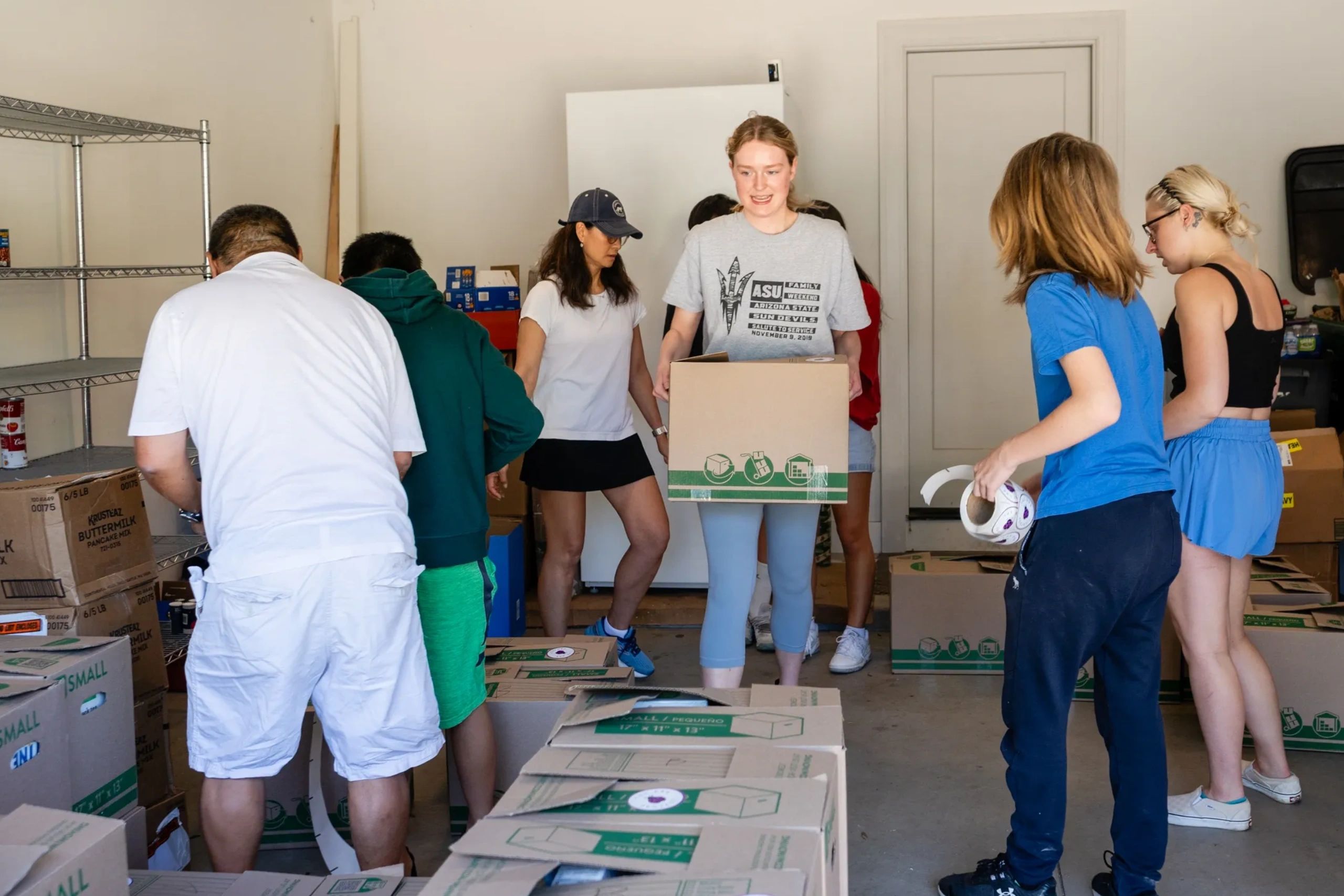 teen agers are arranging donation items