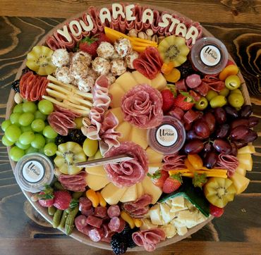 Elegant charcuterie grazing table for a Cedar Rapids corporate event with meats, cheeses, fruit.