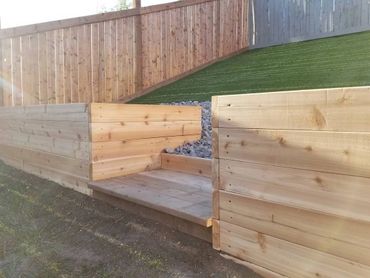 Cedar vegetable garden boxes in the nice backyard