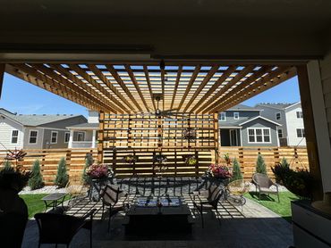 Outdoor living, beautiful combination, a paver patio cedar pergola with a nice seating area/fire pi