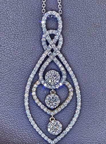 1ct total diamond weight in 14kt Two Tone Gold Pendant.