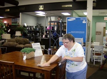 Joanne cleaning at Aaron's Furniture.