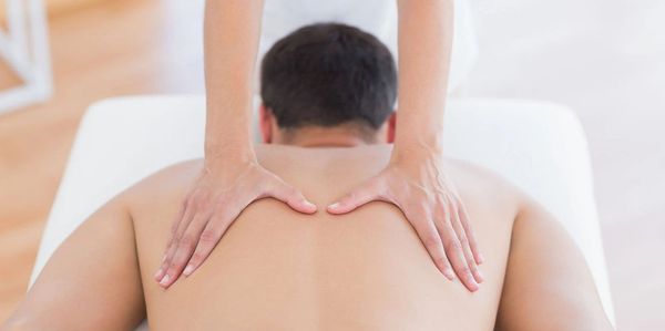 The hands of a skilled massage therapist can sooth the muscles of the mid and lower back.