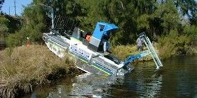 Truxor, fully amphibious aquatic vehicle with low ground pressure allowing maximum weed removal