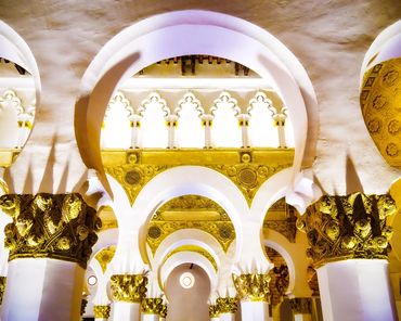 Gold and white details of the Moorish style synagogue and church from ancient Spain.