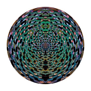 kaleidoscopic abstract photo of blue, green and purple jewel-like glass panels creates a sphere