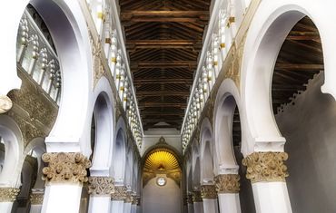 Gold and white pillars support the wood beams of this synagogue and church in ancient Toledo.