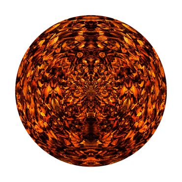 Symmetrical circular photo of orange and brown autumn leaves which have fallen