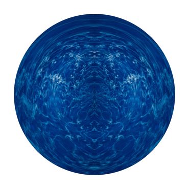 Deep blue sphere with white images in this spherical symmetrical image of water and morning mist