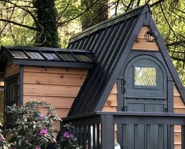 A Frame Playhouse nestled in the trees of an Indiana backyard