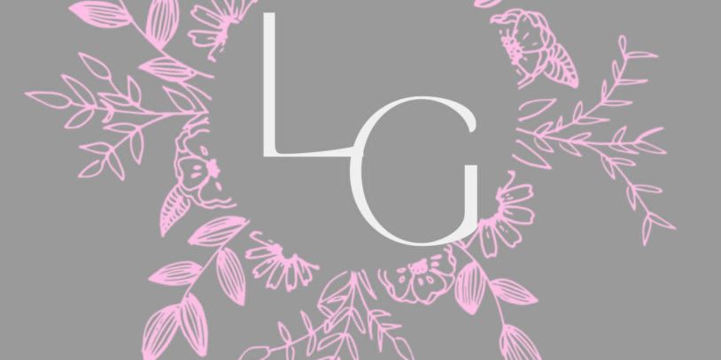Monogram LG with pink floral wreath on gray.