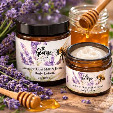 Lavender, goat milk, and honey body lotion in amber jars with lavender flowers.